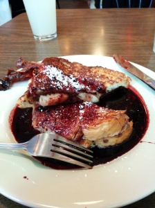 Brie-stuffed French toast with a brandy glaze and mulberry sauce. 